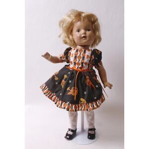 Retro Composition Doll in Halloween-themed Dress with Crazing Craquelure on the